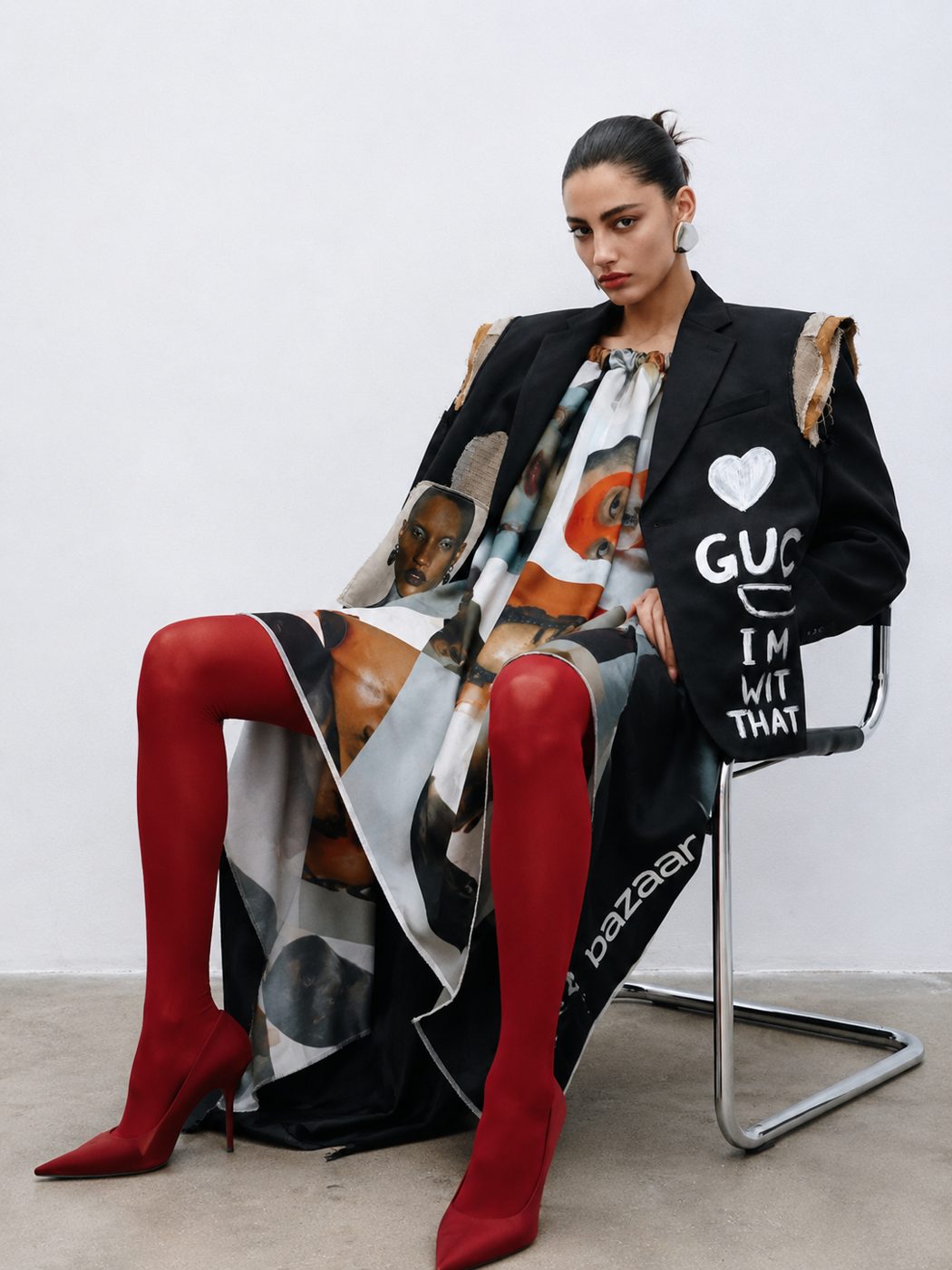 Bazaar editorial: model seated in a hand-painted upcycled blazer